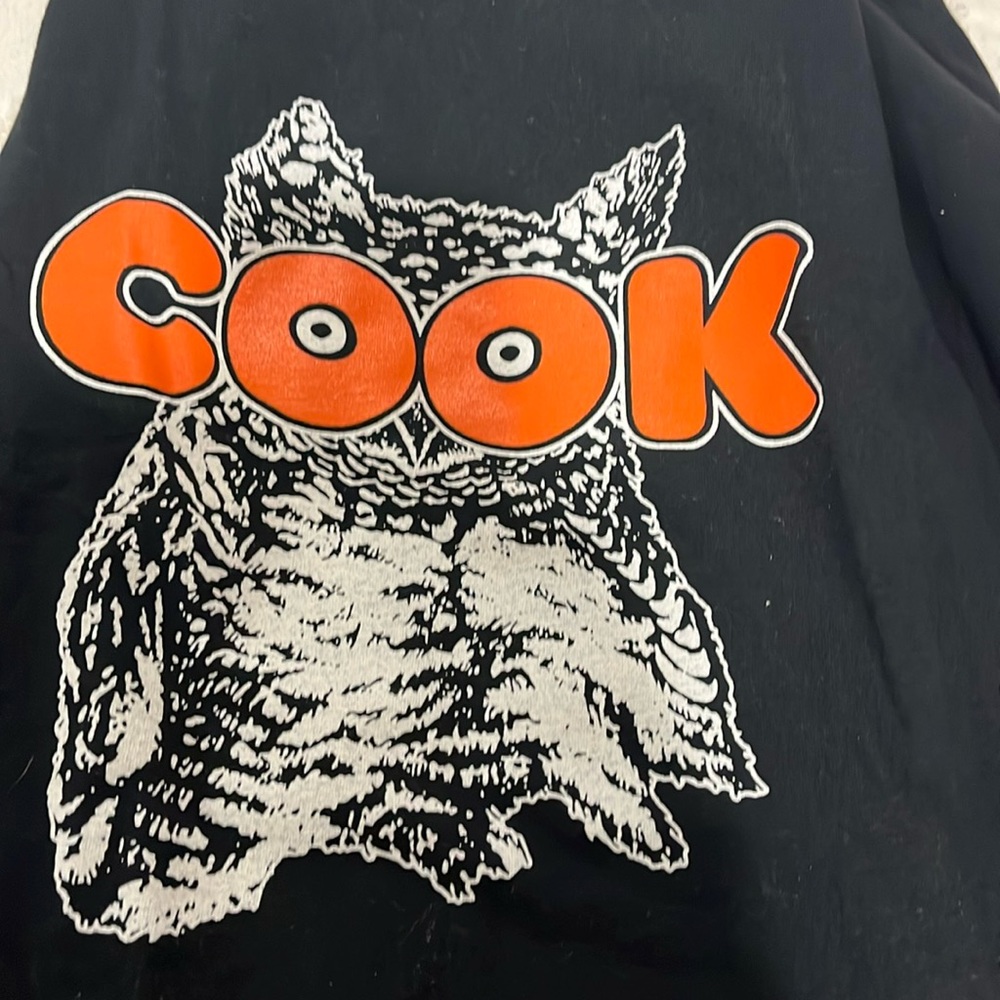 Hooters black short sleeve t with owl on front and knifes on back